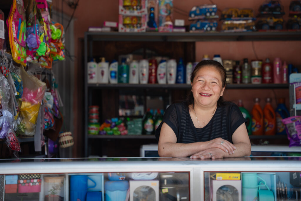 A Guatemalan women works in a convenience store.